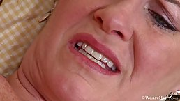 Horny woman is showing her hairy pussy and fingering it in front of the camera