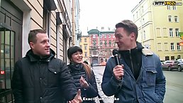 Skinny brunette fucks one guy while giving oral pleasure to the other one, at the same time