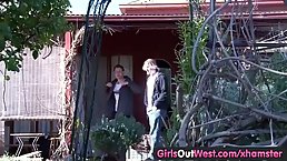 Hairy lesbians are making out and fingering each other's pussy in a public place, during the day