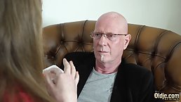 Petite blonde teen is giving a blowjob to an elderly guy and getting some pleasure in return