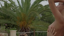 Classy brunette in a black bikini is about to get hammered on the terrace, during the day