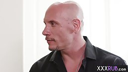 Handsome guy is getting a blowjob from a hot blonde, while they are in a massage room