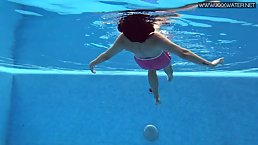 Small titted, teen brunette, Lady Dee got naked and jumped into a swimming pool to relax