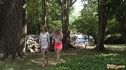 Two amateur teens are having a casual threesome in the forest, with a random horny man