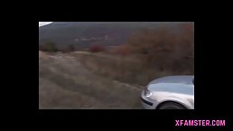 Petite mature blonde is getting fucked in a doggy- style position in the middle of the nature