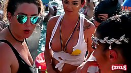 Nasty girls are showing their tits during a pool party and giving hard- ons to guys