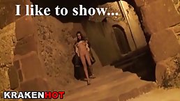 Small titted blonde is posing topless in the middle of the night, in a public place