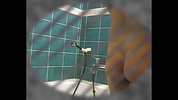 Lovely brunette with big boobs is having a relaxing shower in front of a hidden camera