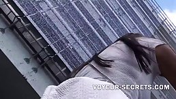 Good looking brunette wasn't aware that a person near her was making an upskirt video