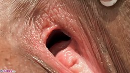 Kinky chick with glasses, Ashley is spreading her pink pussy under the bridge and making close- ups