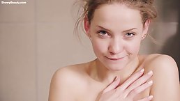 Small titted blonde is having a relaxing bath in front of the camera, just for fun