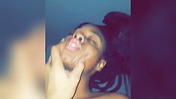 Ebony babe with braided hair is kneeling on the floor and sucking dick, like a pro