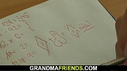 Elderly teacher is getting banged by two much younger guys, while they are alone in the classroom