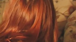 Red haired MILF is about to get her daily dose of fuck on the sofa