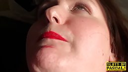 British plumper with red lips is sucking dick and rubbing her pussy, on the couch