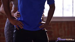 Black hunk is having wild sex with two babes, while they are alone in the gym