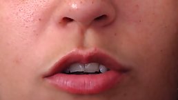 Horny brunette is masturbating and making a close- up of her face, during an orgasm