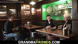 Busty, blonde granny has hooked up with two younger guys and had a threesome with them