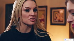 Horny lesbians are having a threesome in the bedroom and moaning from pleasure while cumming
