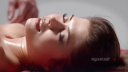 Naked babe with small tits and perky nipples is getting a pussy massage and enjoying it