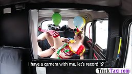 Charming chick in a clown costume is riding a taxi driver's dick in his car