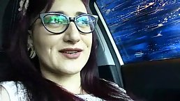Lusty chick with glasses and tattoos is masturbating in the car and moaning while cumming