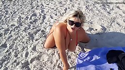 Chubby, blonde mature is relaxing topless on the beach and doesn't care if people see her