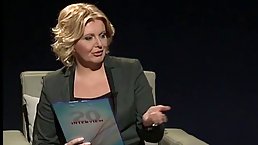 Great looking woman is wearing black pantyhose and high heels as a host of the show