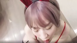 Asian lady in red is sucking dick and getting banged in a doggy- style position