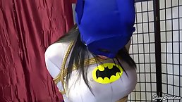 Batwoman got gagged and dominated by a man with a black mask, in his special room
