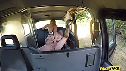 Blonde lady with big, black glasses had anal sex in the back of a taxi