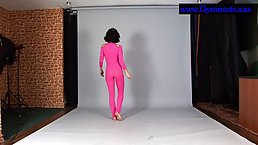 Flexible brunette in a sheer, pink costume, Violeta is proudly showing us her impressive skills