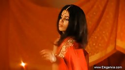 Exotic Indian brunette is slowly taking off her clothes and touching herself in a very naughty way