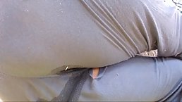 Amateur babe in loose pants is spreading her legs wide open and showing her pussy