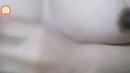Passionate chick is talking to her lover on the phone and touching herself in a naughty way