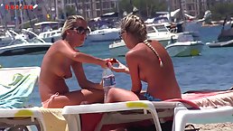 Gorgeous blondes don't mind being naked on the beach, knowing that guys would stare at them