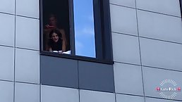 Horny couple is fucking by the window so most of the neighborhood can see them in action