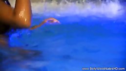 Exotic brunette is naked in the swimming pool not knowing that someone is secretly watching her