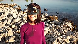 Chick with a black mask is sucking a rock hard cock in the nature, in the afternoon