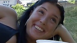 Big titted brunette is sucking her married neighbor's dick outdoors, while no one is watching them