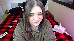Blue- eyed girl is sucking a big, fake dick and drilling her tight pussy with it
