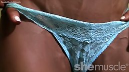 Tanned blonde with defined muscles is wearing erotic lingerie and touching herself in a naughty way