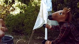 Beautiful, blonde housewife and a man with a mask are fucking in the backyard during the day
