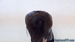 Asian brunette is often peeing in a public place or in front of the camera