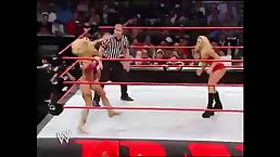 Trish Stratus and Terri Runnels are wrestling in front of many people and getting extremely excited