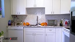 Big titted blonde is getting banged in the kitchen and trying hard not to moan too loud