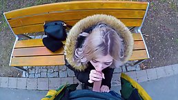 Adorable, blonde teen is giving an impressive blowjob to a horny stranger, in a local park