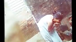 Indian woman was washing laundry and having a bath, not knowing that someone was watching her
