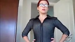 Red haired mature in shoes with high heels is about to play with a stiff cock