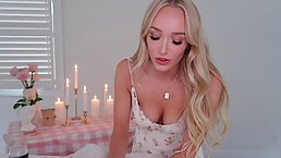 Sweet blonde is giving a blowjob to a friend, while he is trying to hold the camera